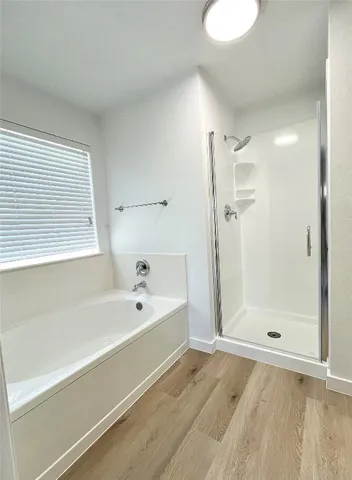 a view of empty room with ceiling fan