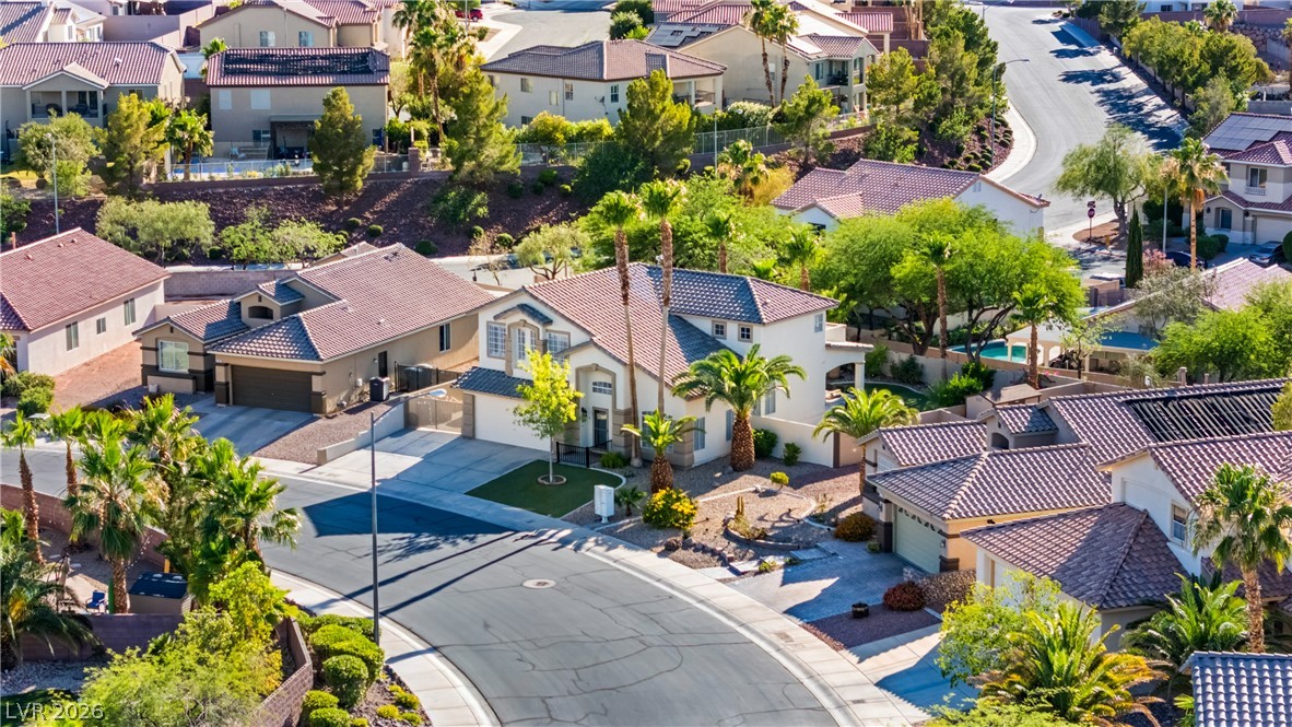 708 Vortex Avenue Henderson, NV 89002 - Photo 58 of 71 An aerial perspective showcases this residential community, featuring well-maintained homes and lush landscaping.