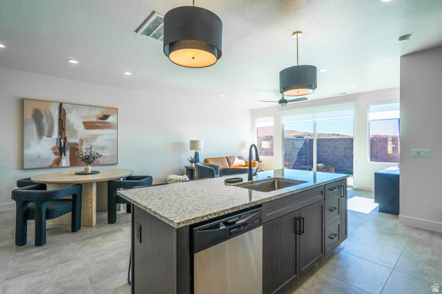 2972 West 570 North Hurricane, UT 84737 - Photo 103 of 104 Kitchen featuring a kitchen island with sink, dishwasher, open floor plan, light stone countertops, and ceiling fan