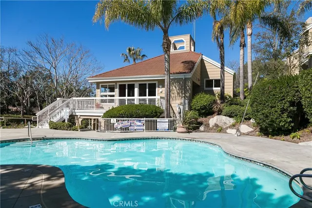 a view of a chair and tables in the patio