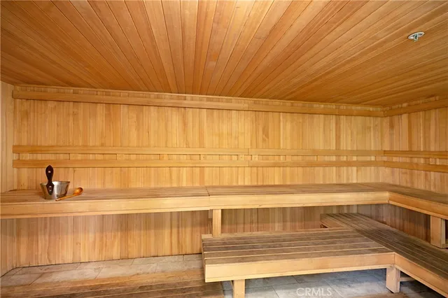 a room with pool table flat screen tv and couches in a room