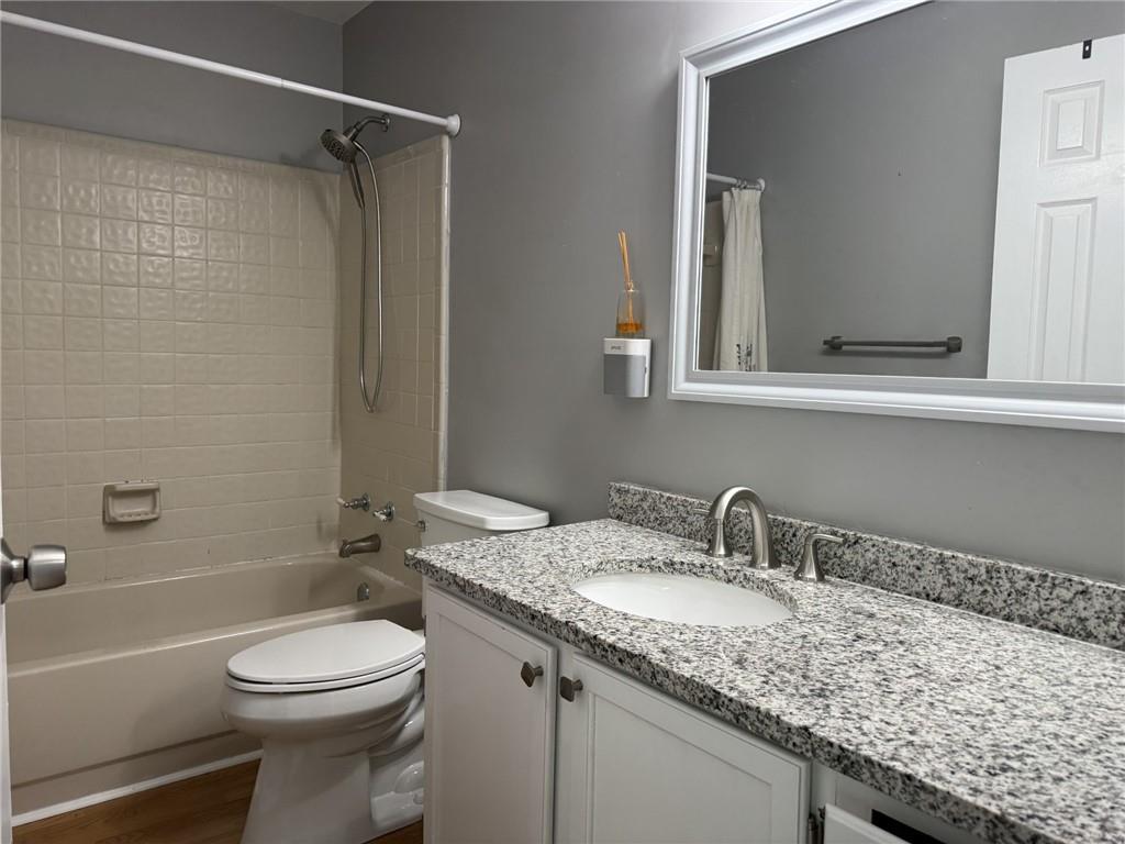 105 Hawkstone Way Alpharetta, GA 30022 - Photo 19 of 23 a bathroom with a granite countertop sink toilet and shower