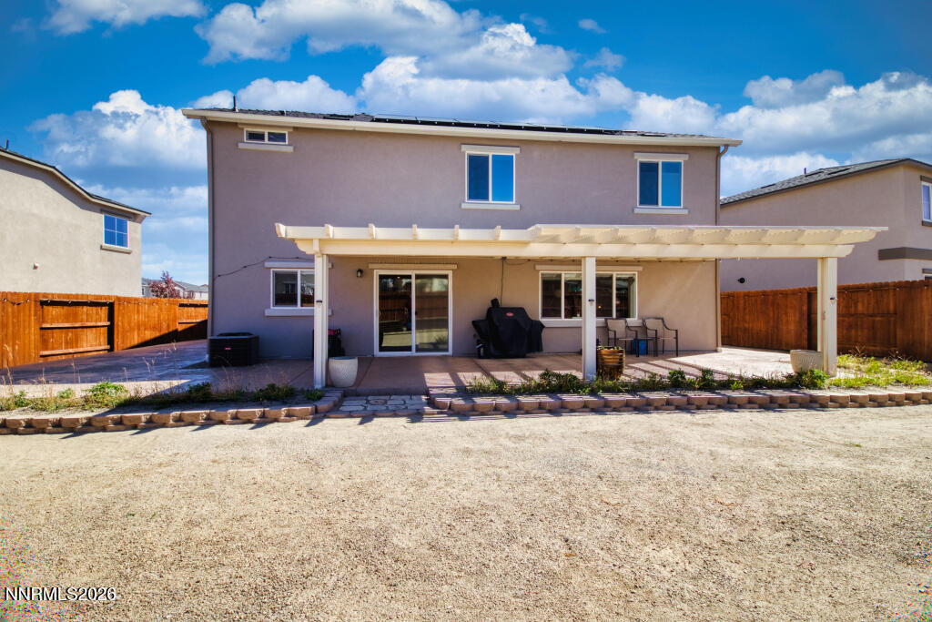 8957 Buffalo Grove Drive Reno, NV 89506 - Photo 45 of 59 a front view of a house with a yard