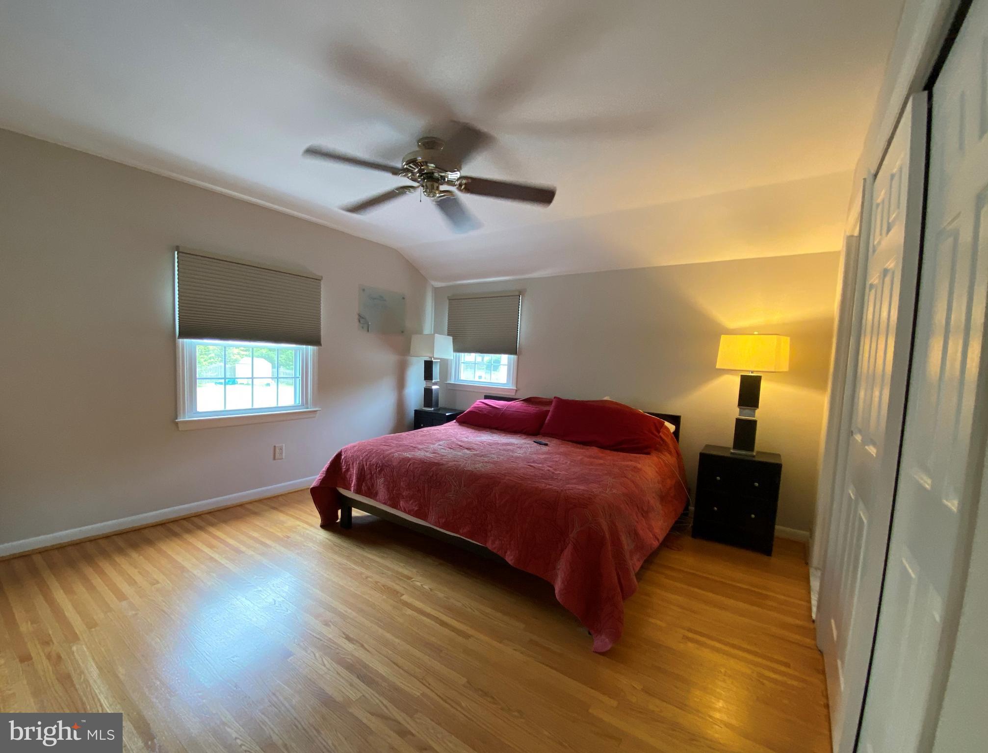 555 Tarrington Road Cherry Hill, NJ 08034 - Photo 14 of 19 a bedroom with a bed and wooden floor