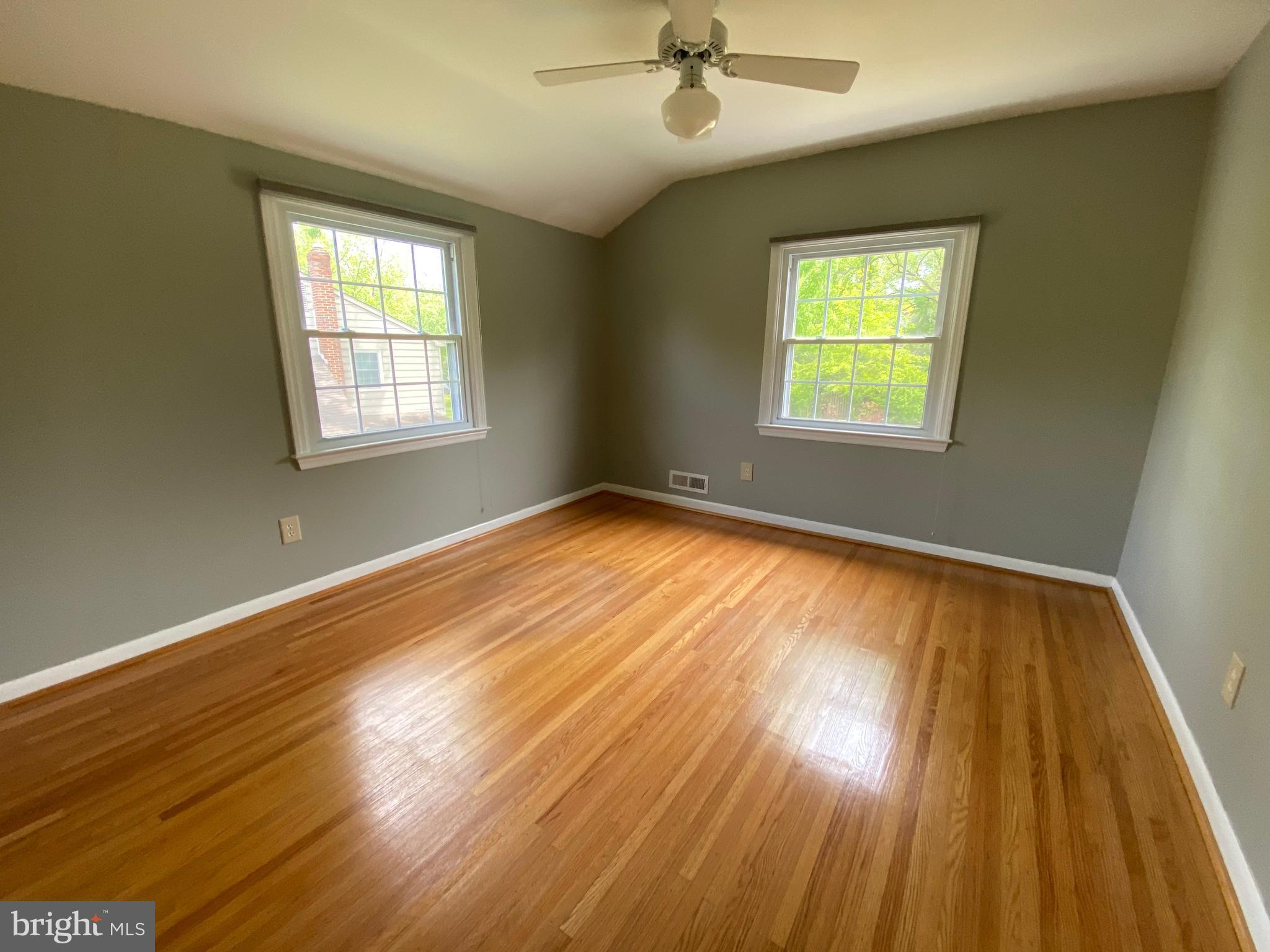 555 Tarrington Road Cherry Hill, NJ 08034 - Photo 16 of 19 a view of an empty room with wooden floor and a window