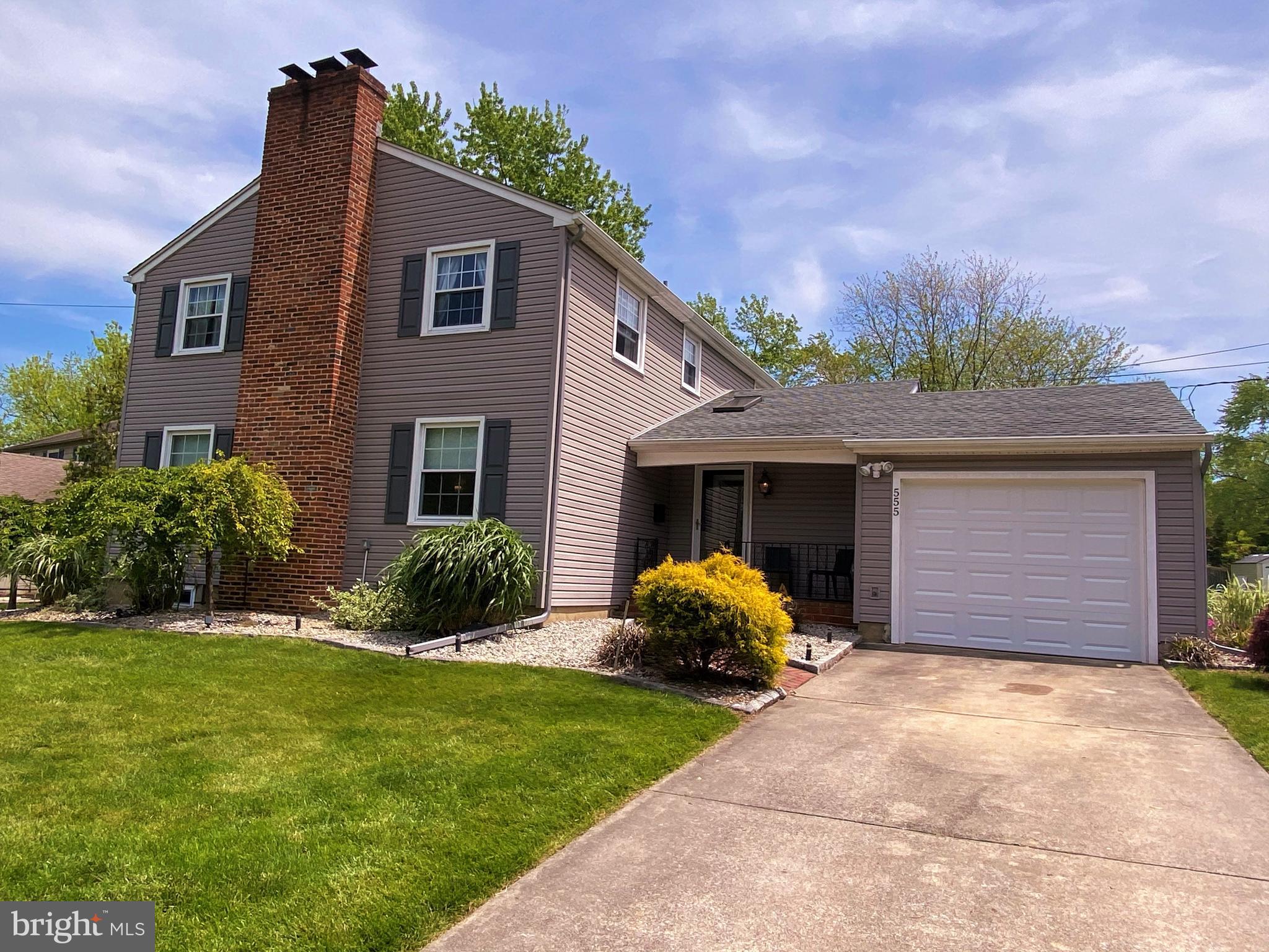 555 Tarrington Road Cherry Hill, NJ 08034 - Photo 19 of 19 a front view of a house with a yard and garage