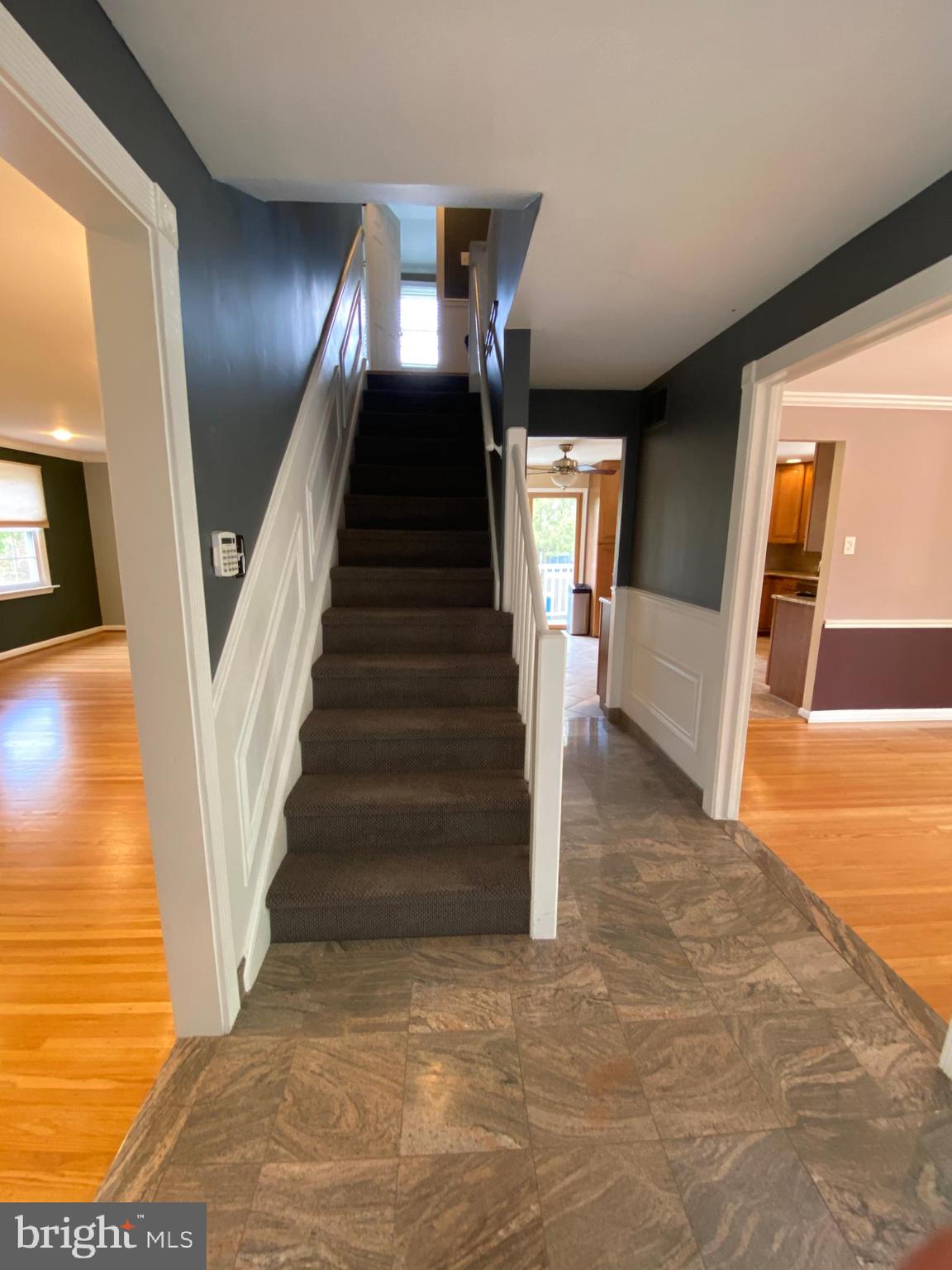 555 Tarrington Road Cherry Hill, NJ 08034 - Photo 6 of 19 a view of a hallway with wooden floor and entryway