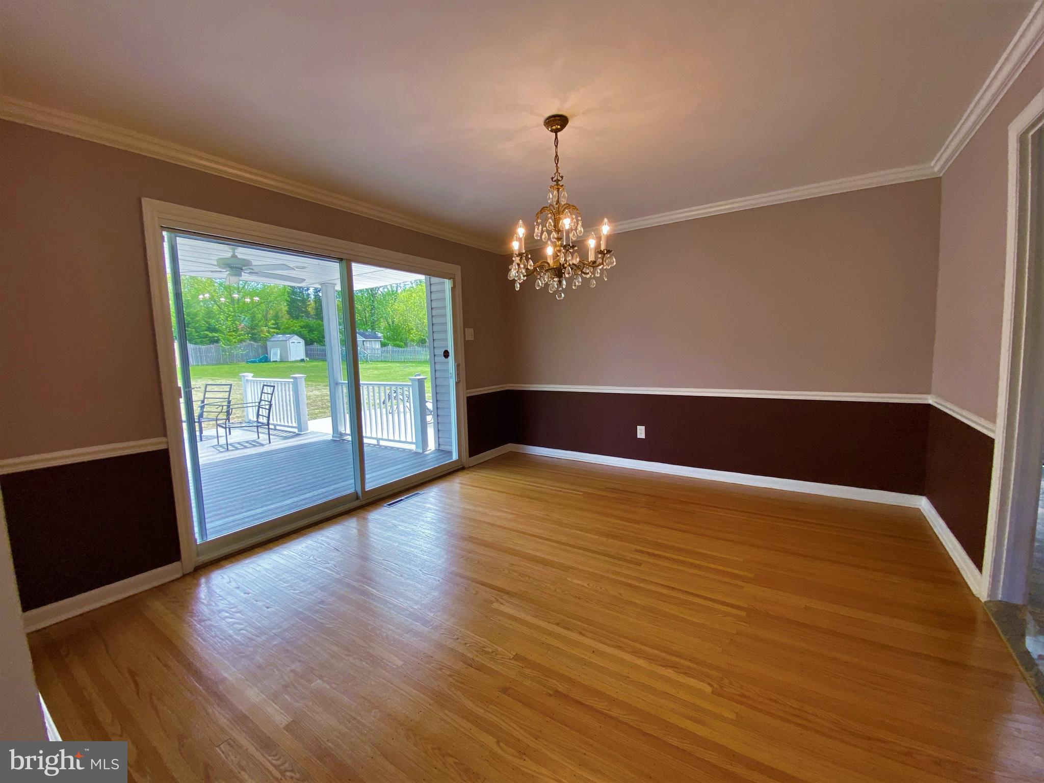 555 Tarrington Road Cherry Hill, NJ 08034 - Photo 10 of 19 a view of an empty room with wooden floor and a window