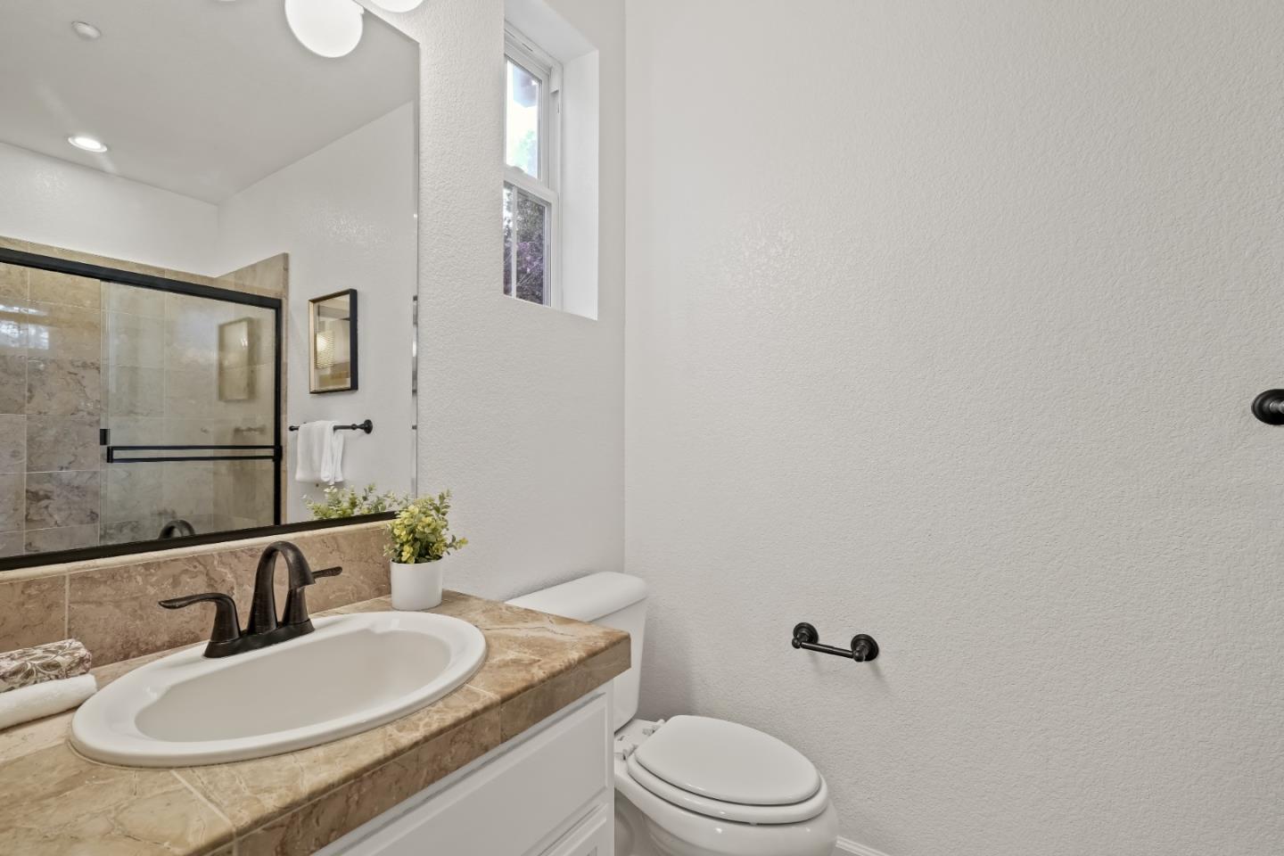 451 Chagall Street Mountain View, CA 94041 - Photo 47 of 58 a bathroom with a granite countertop sink mirror a toilet and a mirror