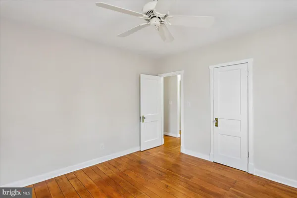 a view of a door with a wooden wall