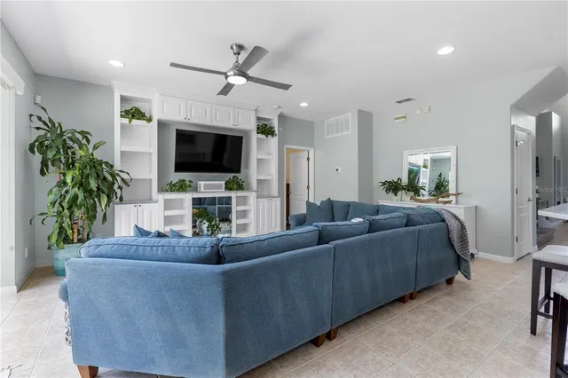 a kitchen with stainless steel appliances granite countertop white cabinets and a stove a oven with white countertops