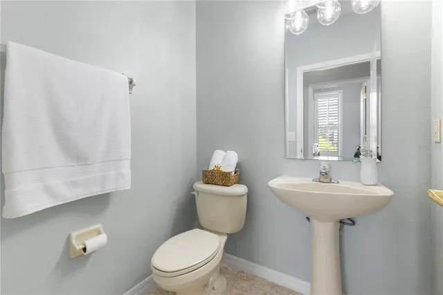 a bathroom with a tub shower and a sink