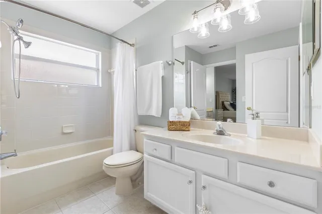 a view of a chair and tables in the patio