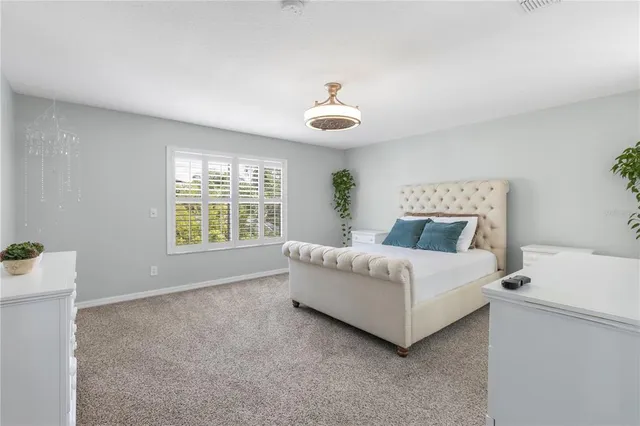 a view of a garden with a building in the background