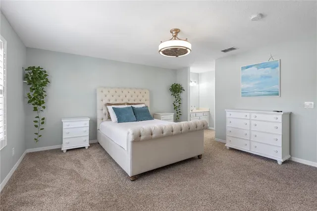 a house with palm tree in front of it