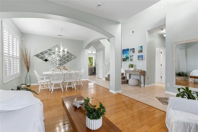 a view of a dining room with furniture and chandelier