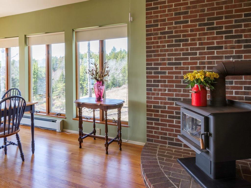 419 Pemaquid Harbor Road Pemaquid, ME 04558 - Photo 12 of 34 Woodstove in sunroom