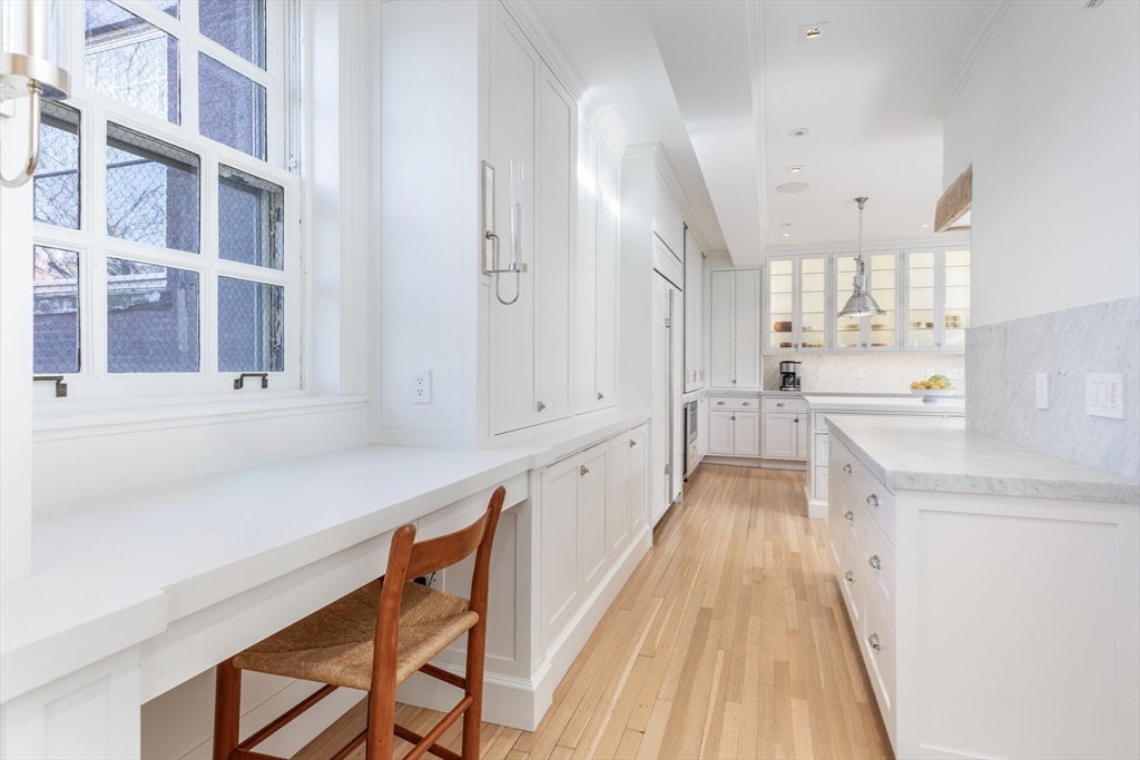 62 Beacon Street, Unit 3 Boston, MA 02108 - Photo 11 of 25 a view of a kitchen with a sink and cabinets