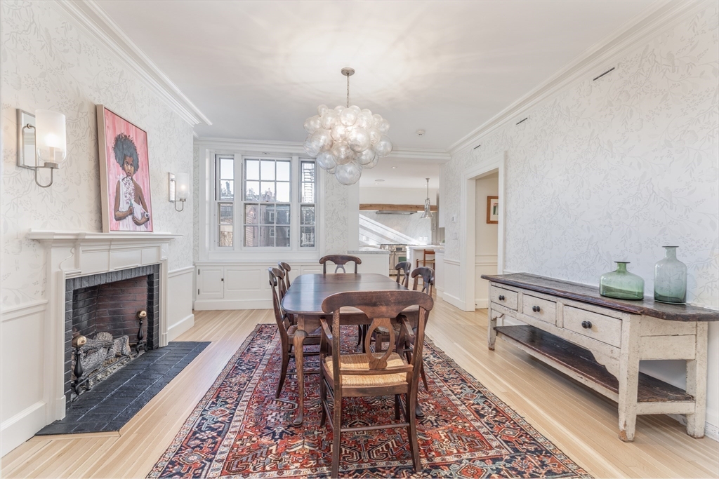 62 Beacon Street, Unit 3 Boston, MA 02108 - Photo 14 of 25 a view of a dining room with furniture and chandelier
