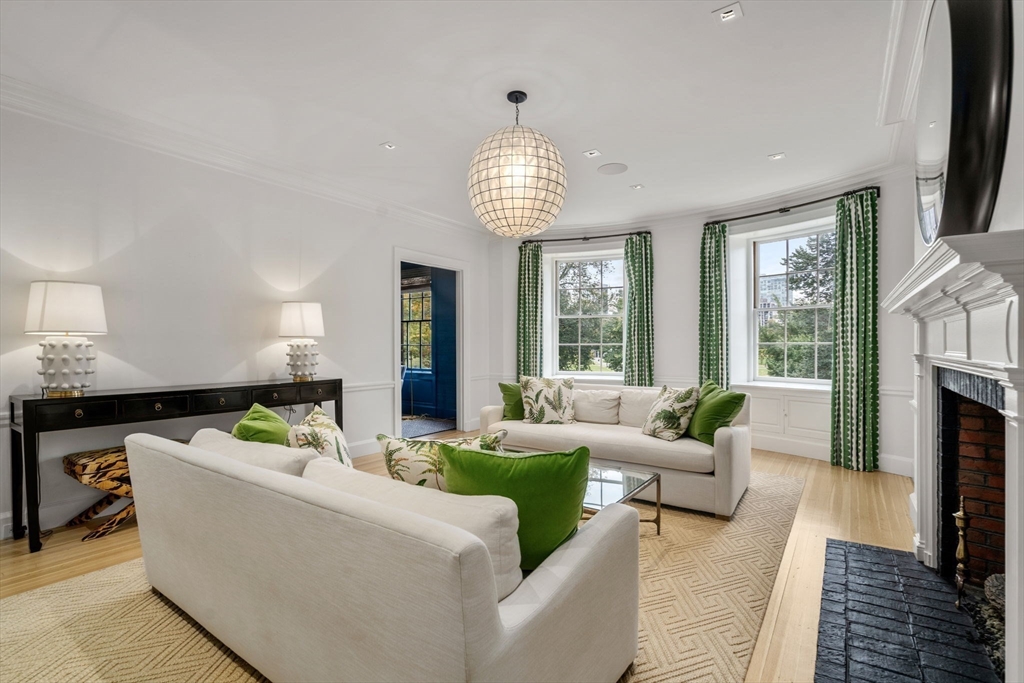 62 Beacon Street, Unit 3 Boston, MA 02108 - Photo 2 of 25 a living room with furniture fireplace and a large window