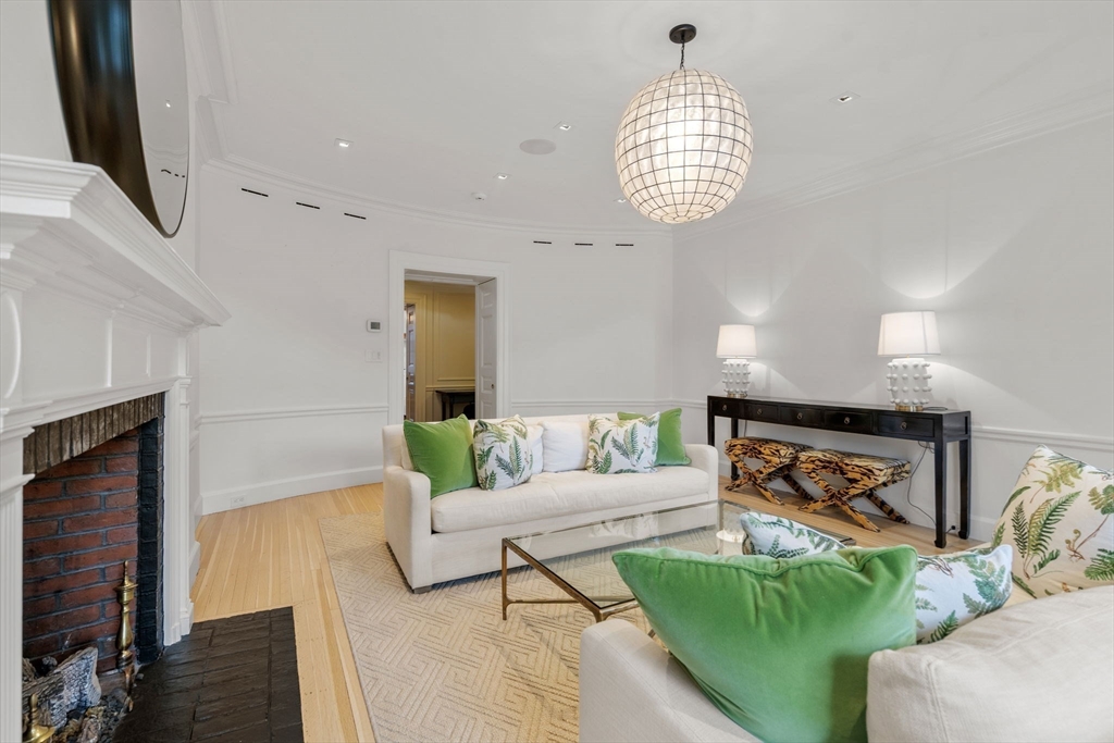 62 Beacon Street, Unit 3 Boston, MA 02108 - Photo 3 of 25 a living room with furniture and a chandelier