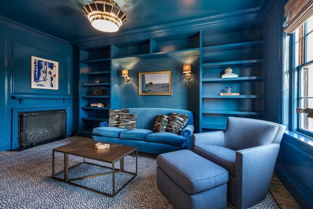 62 Beacon Street, Unit 3 Boston, MA 02108 - Photo 4 of 25 a living room with furniture a rug and a fireplace