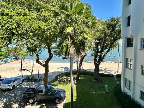 a view of swimming pool yard and lake view