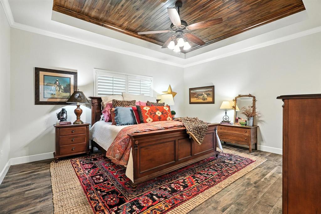 136 Dove Run Tuscola, TX 79562 - Photo 17 of 36 Bedroom featuring wooden ceiling, crown molding, dark wood-type flooring, and ceiling fan