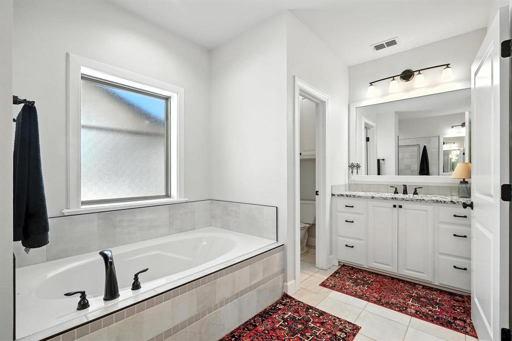 136 Dove Run Tuscola, TX 79562 - Photo 20 of 36 Full bathroom with garden tub, and tile flooring