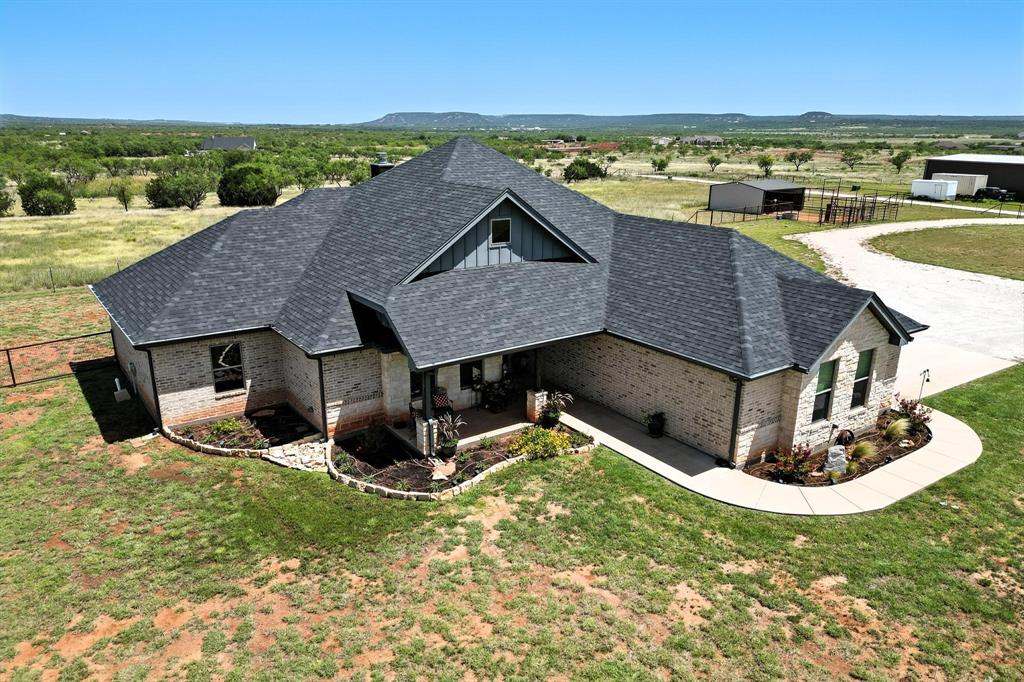 136 Dove Run Tuscola, TX 79562 - Photo 2 of 37 View from above of property with a mountainous background