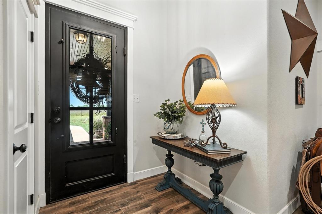 136 Dove Run Tuscola, TX 79562 - Photo 7 of 37 Entryway featuring baseboards and dark wood-style flooring