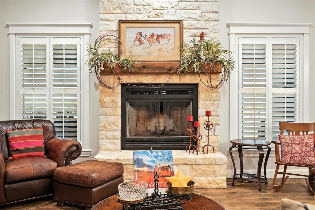 136 Dove Run Tuscola, TX 79562 - Photo 8 of 37 Living area featuring a fireplace and wood finished floors