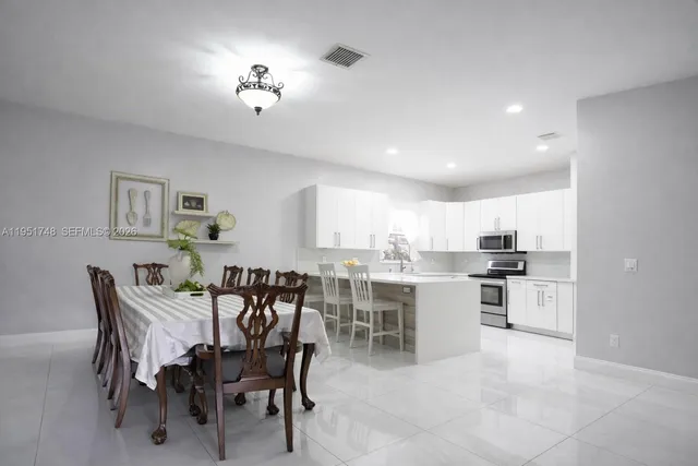a view of a dining room kitchen and a window
