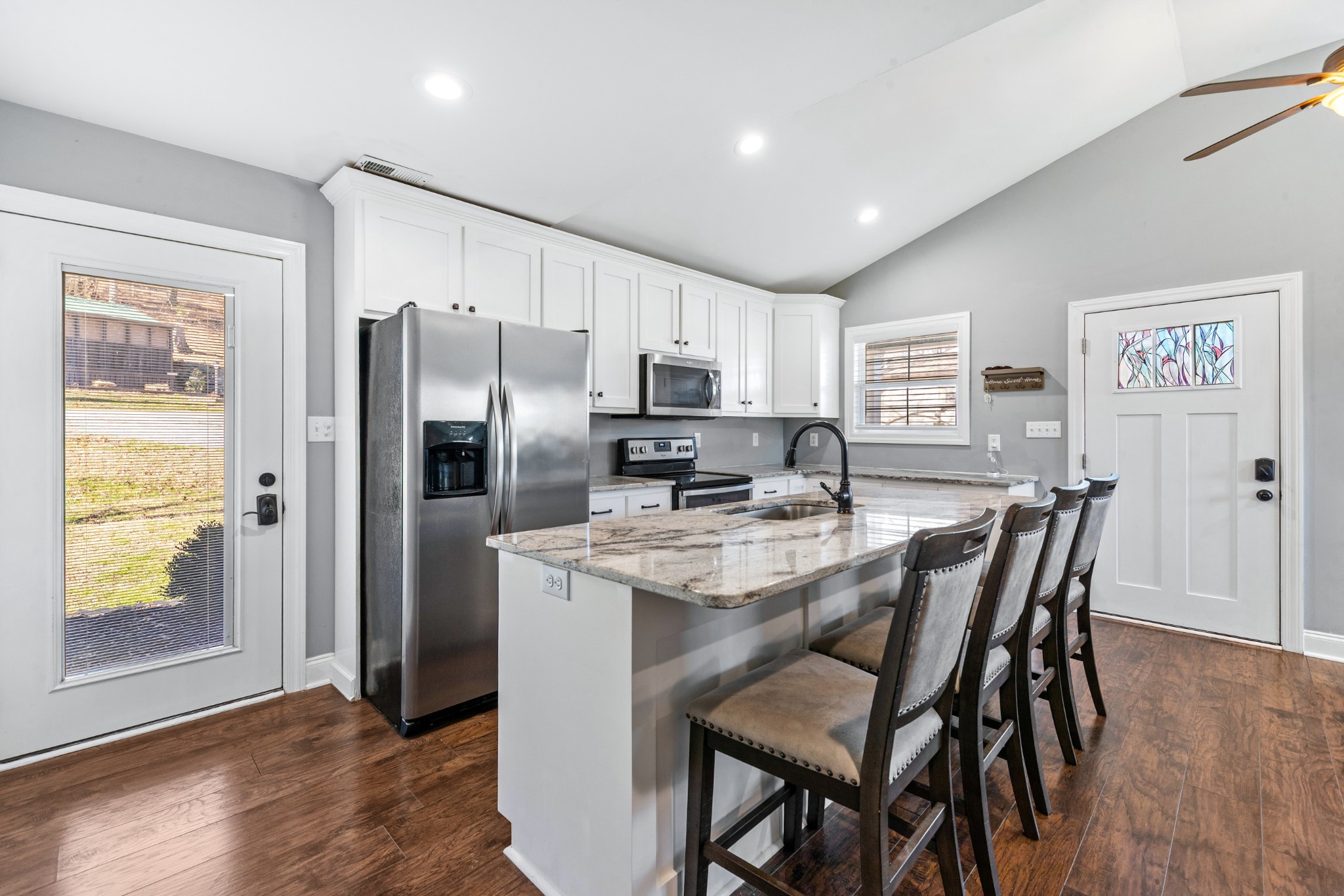 807 Clear Creek Road Pulaski, TN 38478 - Photo 17 of 68 a kitchen with granite countertop a refrigerator and a stove top oven