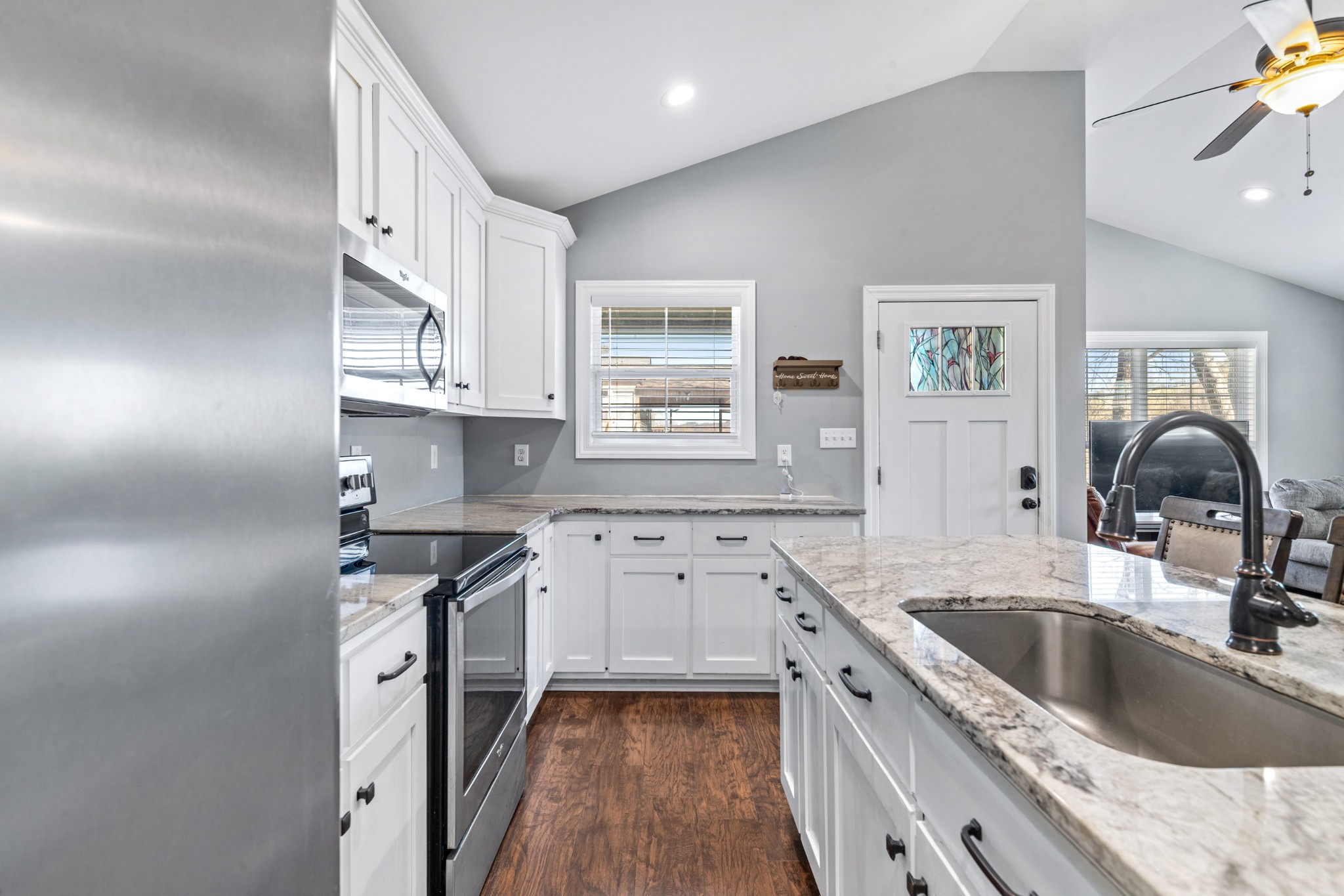 807 Clear Creek Road Pulaski, TN 38478 - Photo 21 of 68 a kitchen with granite countertop a sink stove and cabinets