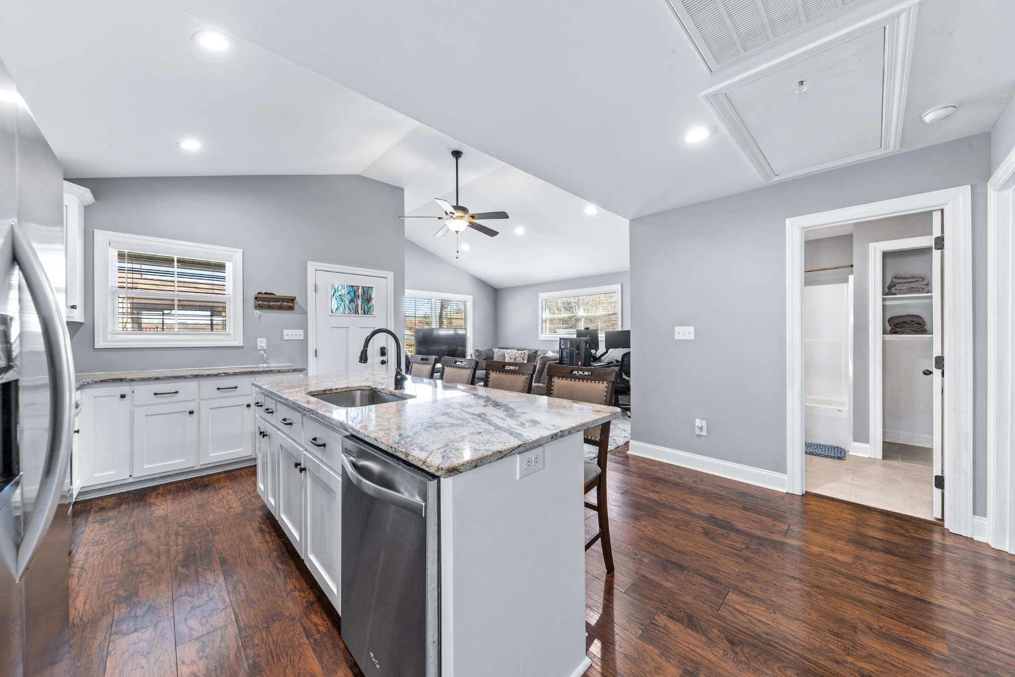 807 Clear Creek Road Pulaski, TN 38478 - Photo 22 of 68 a kitchen with granite countertop a sink stove and wooden floor