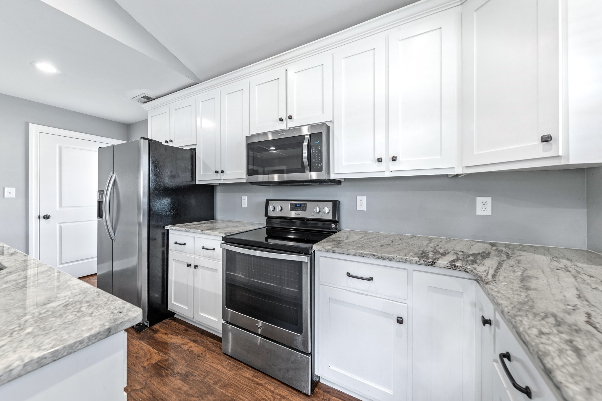 807 Clear Creek Road Pulaski, TN 38478 - Photo 24 of 68 a kitchen with granite countertop cabinets stainless steel appliances and a counter space