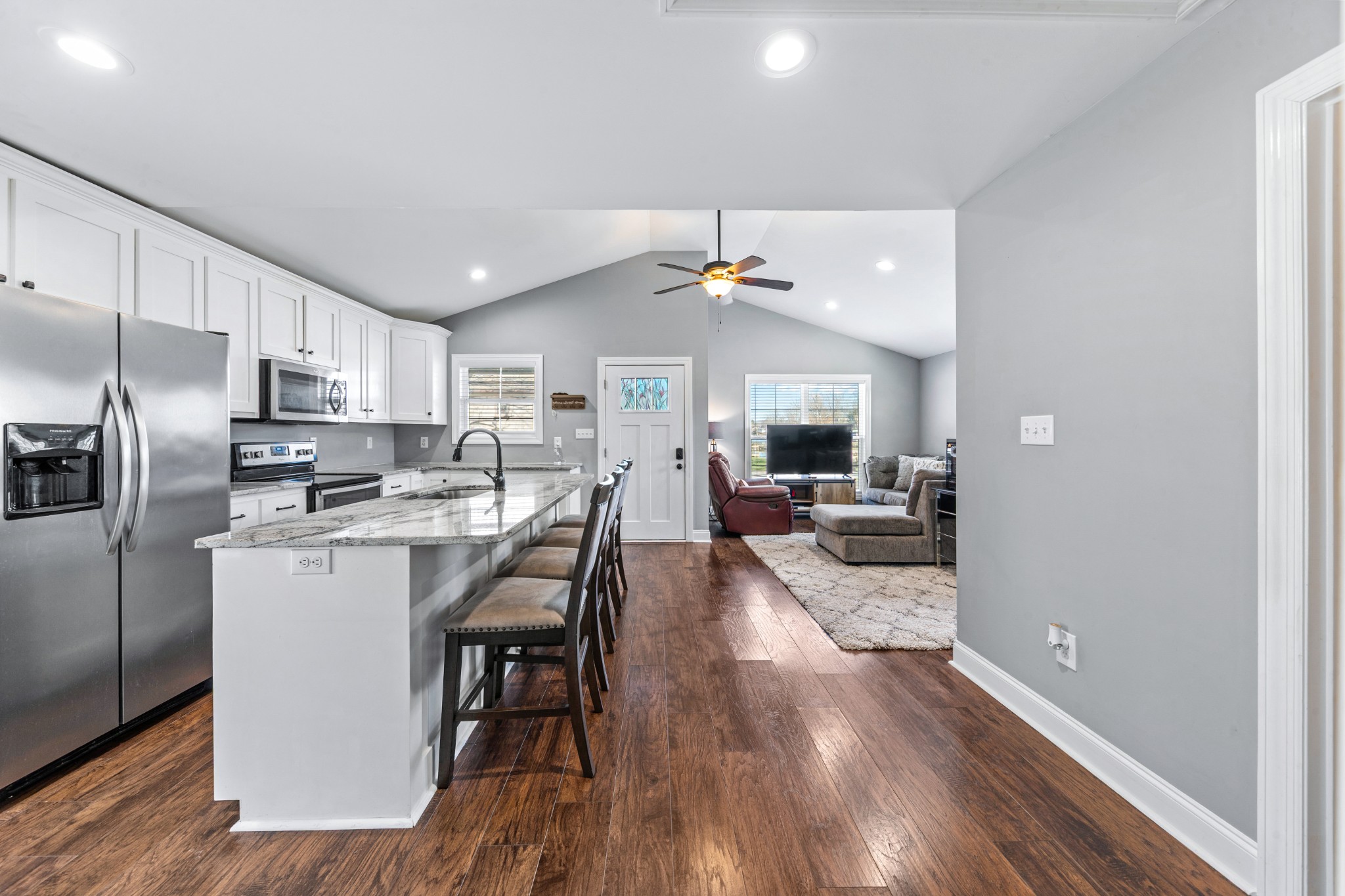 807 Clear Creek Road Pulaski, TN 38478 - Photo 25 of 68 a kitchen with a table chairs refrigerator and microwave