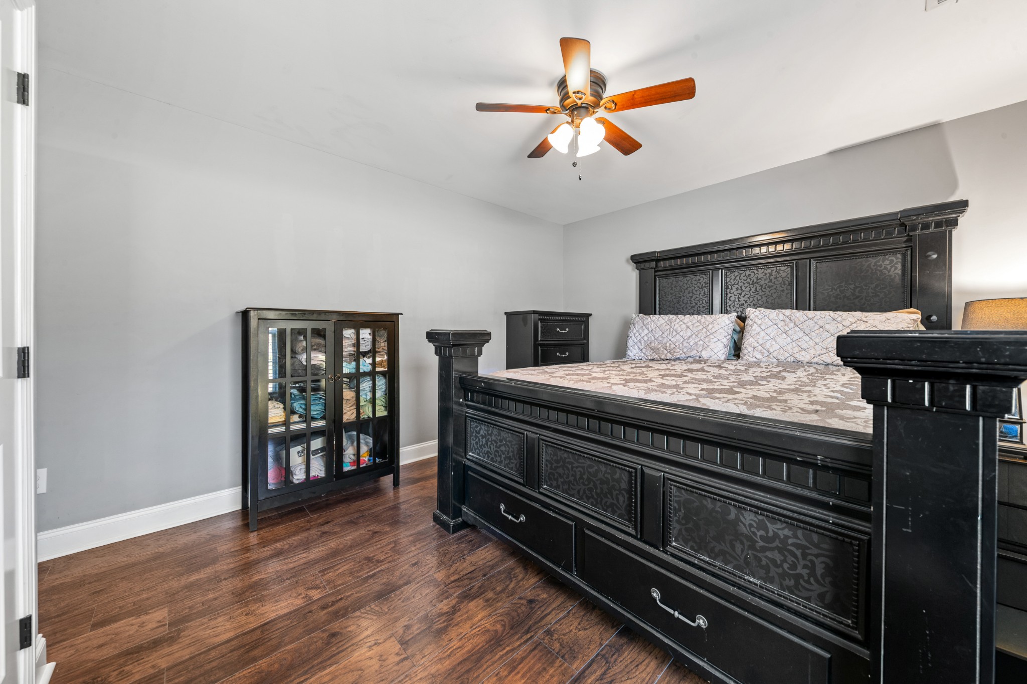 807 Clear Creek Road Pulaski, TN 38478 - Photo 29 of 68 a bedroom with a bed and a chandelier