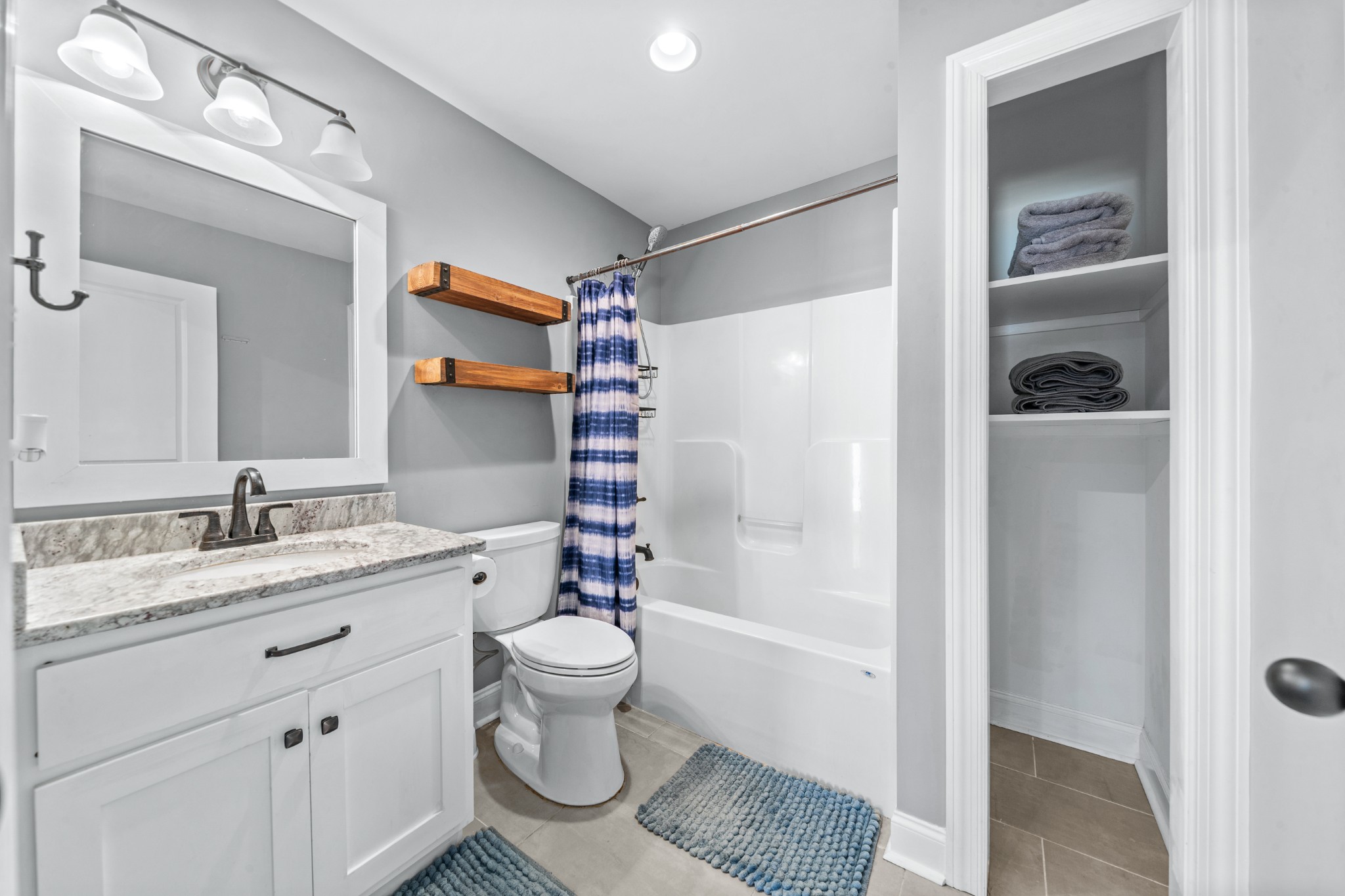 807 Clear Creek Road Pulaski, TN 38478 - Photo 30 of 68 a bathroom with a granite countertop sink toilet and shower