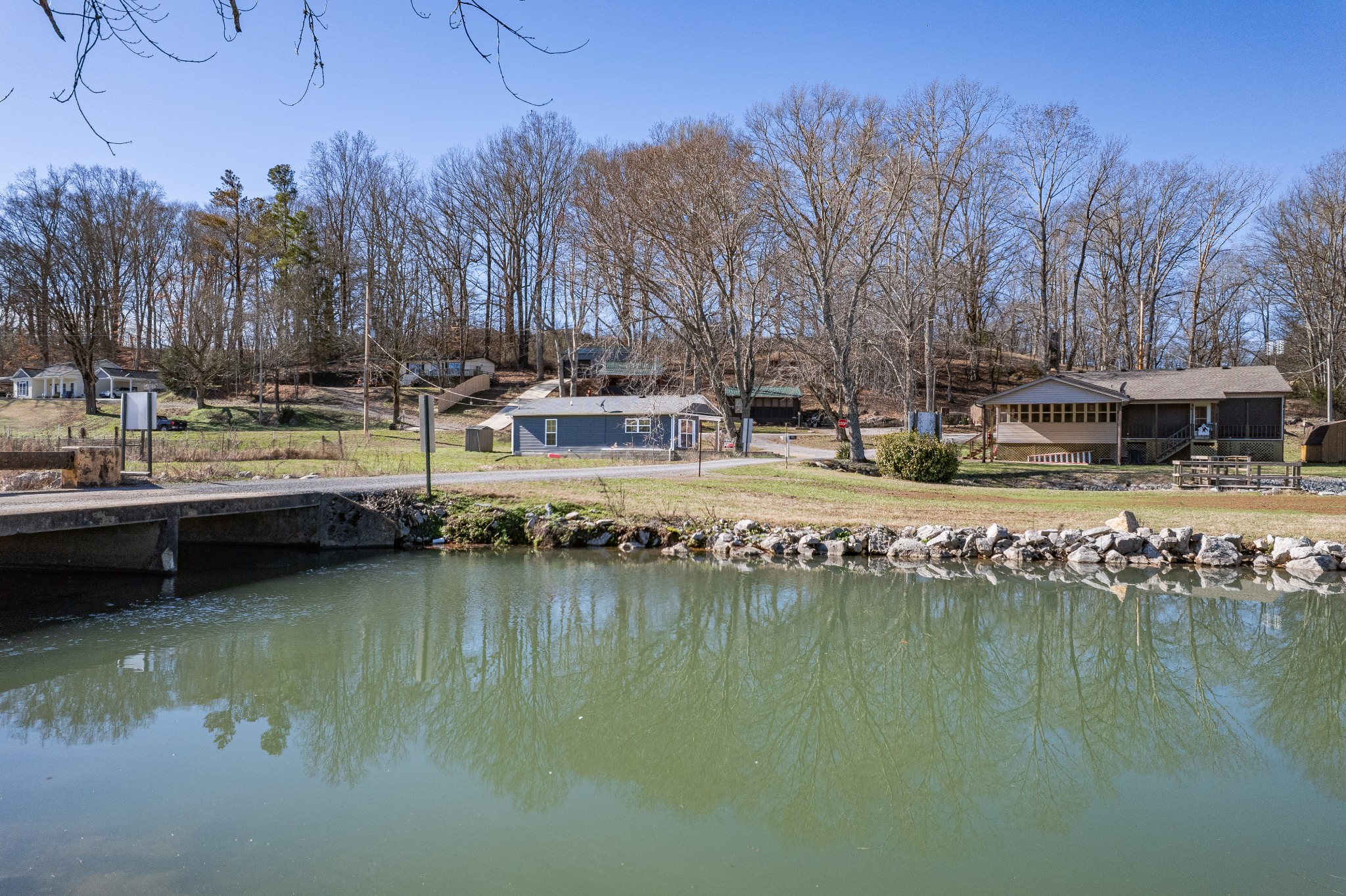 807 Clear Creek Road Pulaski, TN 38478 - Photo 40 of 68 a view of swimming pool with outdoor seating and lake view