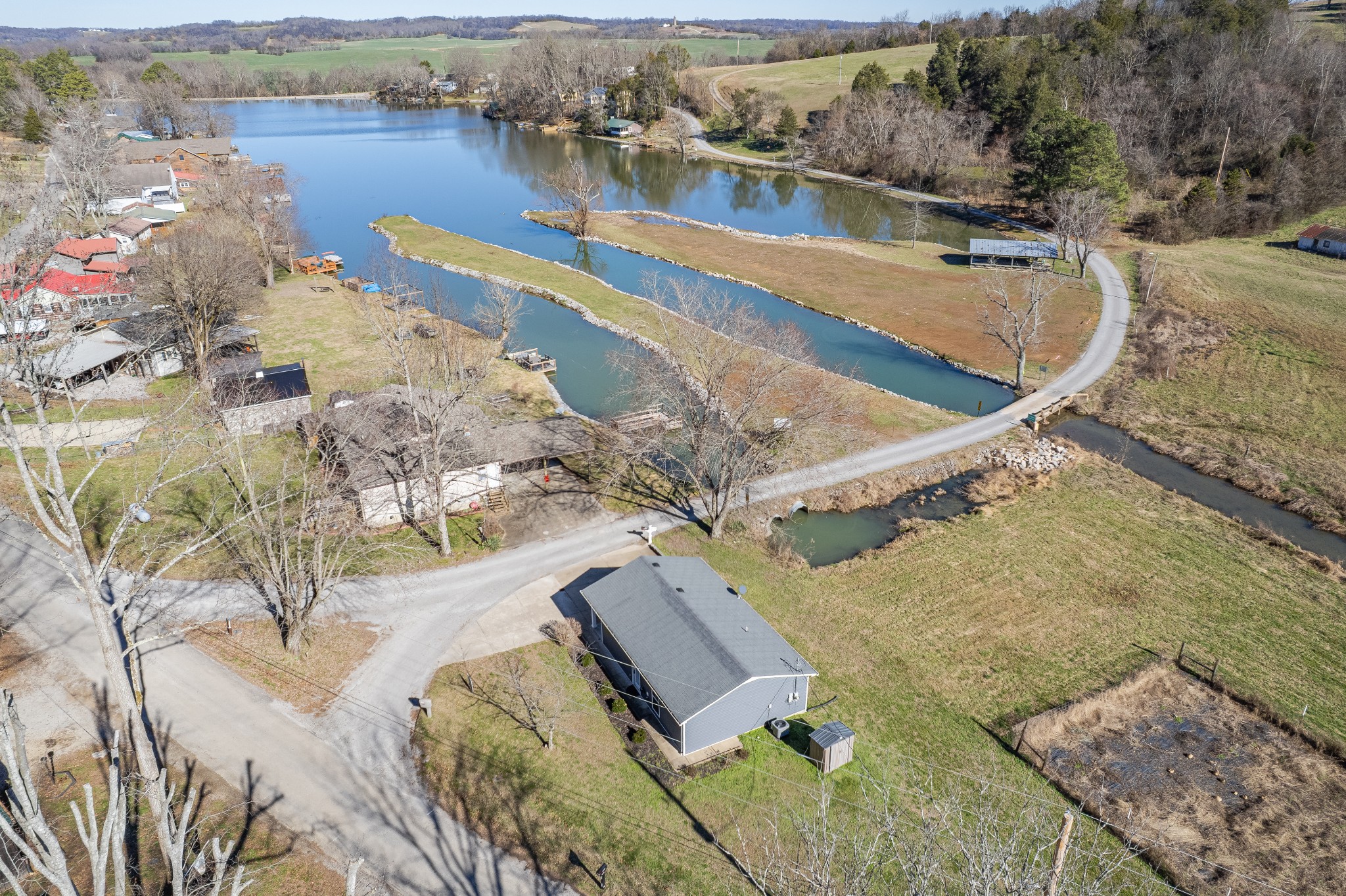 807 Clear Creek Road Pulaski, TN 38478 - Photo 46 of 68 a view of a lake with a mountain in the background