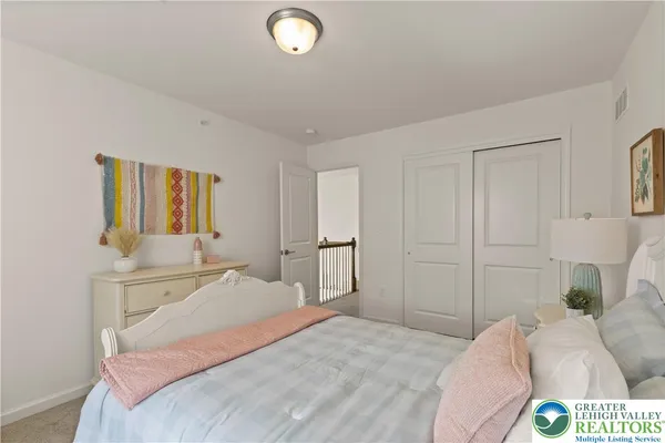 a bedroom with a bed and a cabinets