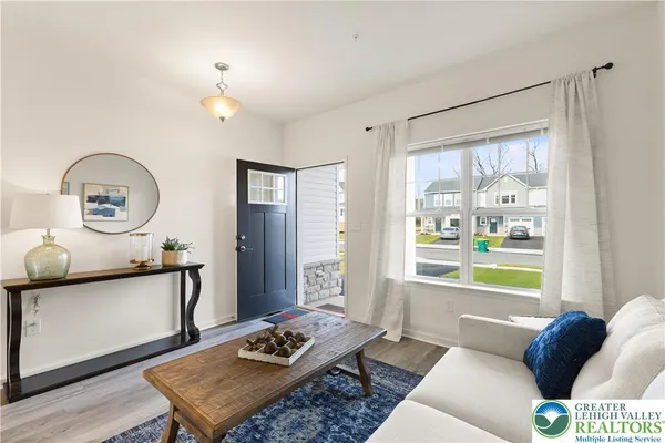 a living room with furniture and a window
