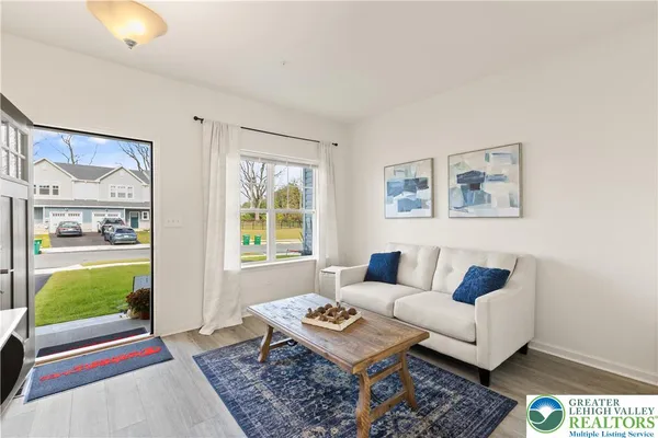 a living room with furniture and a window