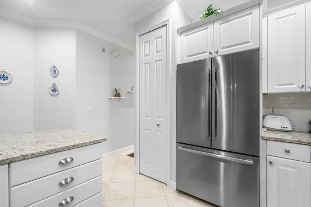 a bedroom with a bed a table and chair