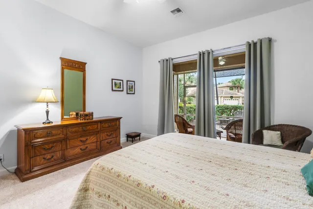 a bathroom with a granite countertop sink mirror and toilet