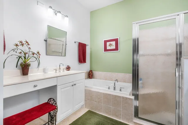 a view of a chair and table in backyard of the house