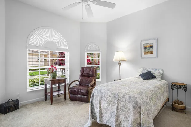 a view of a chairs and table in the balcony