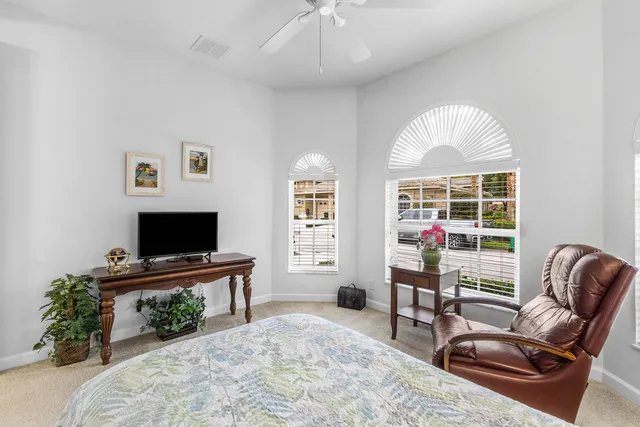 a view of a balcony with furniture